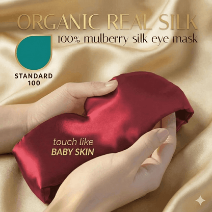 Premium Mulberry Silk Sleep Mask for Side Sleepers in rich burgundy color, held on soft satin fabric.